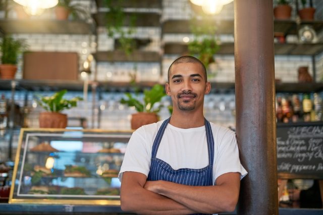 Portrait,,Business,And,Brazilian,Man,At,Cafe,With,Confidence,In